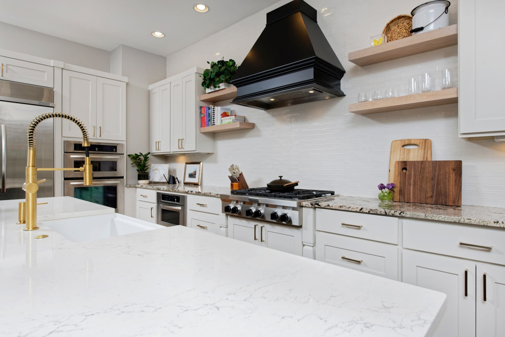 Inspiration for a mid-sized contemporary l-shaped separate kitchen in Santa Barbara with an undermount sink, shaker cabinets, stainless steel appliances, medium hardwood floors and with island.