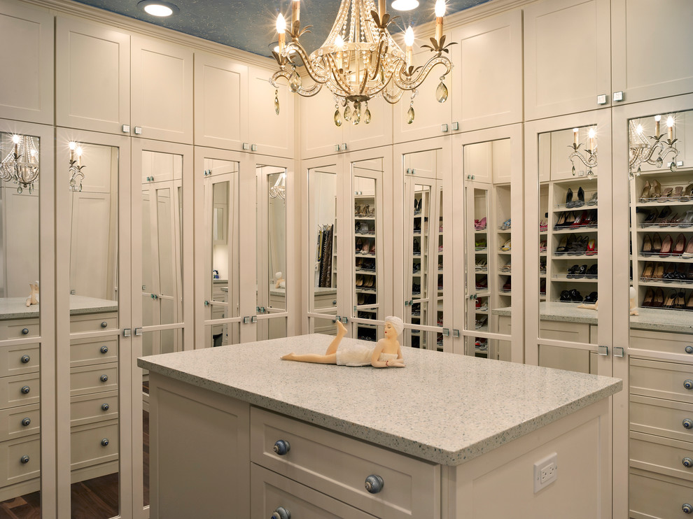 Inspiration for a mid-sized contemporary gender-neutral dressing room in Tampa with shaker cabinets, white cabinets, dark hardwood floors and brown floor.