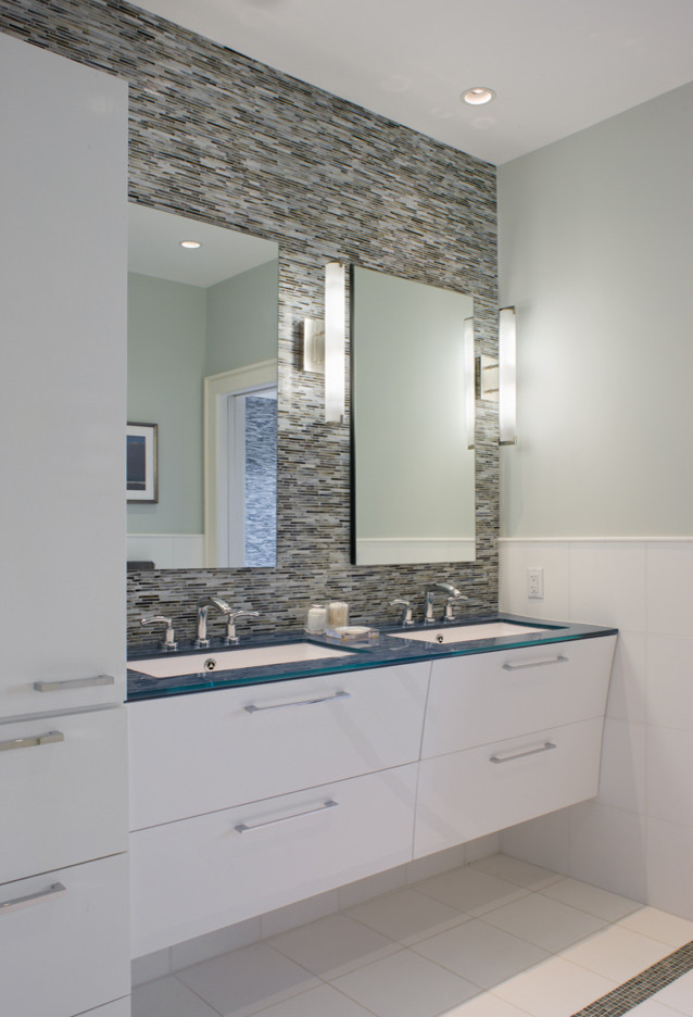 Design ideas for a mid-sized transitional master bathroom in Providence with flat-panel cabinets, white cabinets, beige tile, gray tile, multi-coloured tile, white tile, glass tile, grey walls, ceramic floors, an undermount sink and glass benchtops.