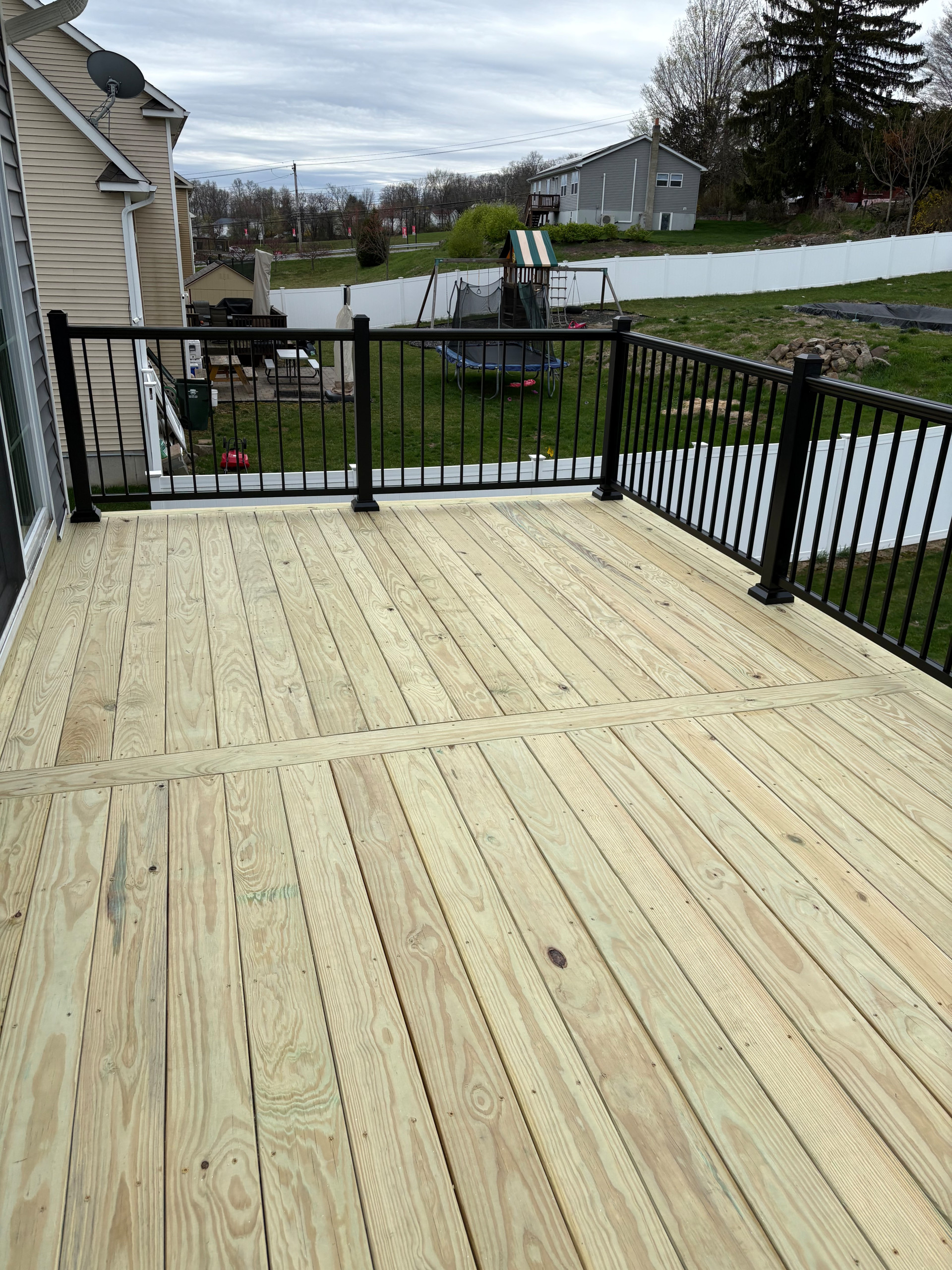 Pressure Treated Wood  Deck with black powder coated rail