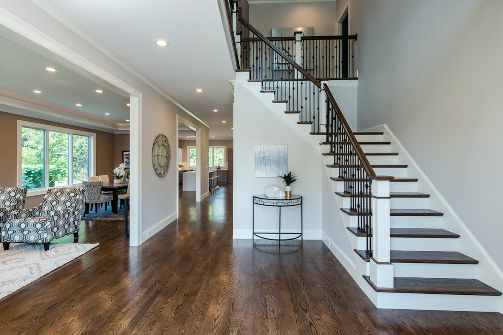 Mid-sized transitional dark wood floor and brown floor foyer photo in Boston with beige walls