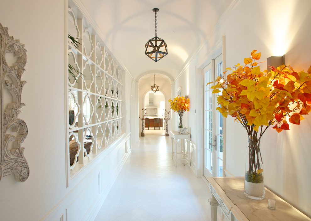 Trendy white floor hallway photo in Miami with white walls