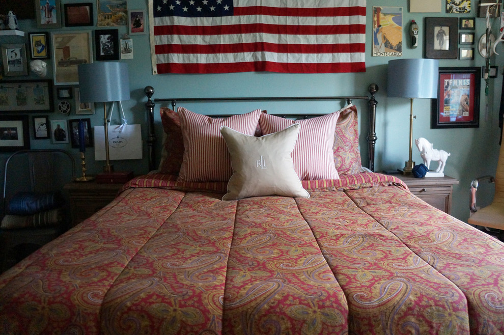Photo of a mid-sized country guest bedroom in Other with blue walls and carpet.