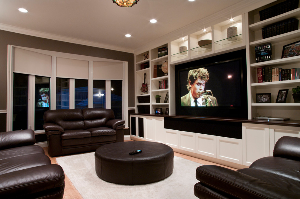 This is an example of a small transitional enclosed family room in Vancouver with a wall-mounted tv.