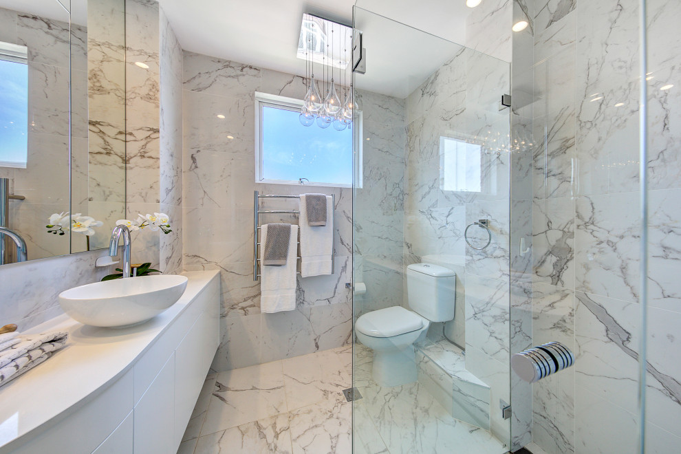Inspiration for a large contemporary 3/4 bathroom in Sydney with flat-panel cabinets, white cabinets, a corner shower, a two-piece toilet, gray tile, porcelain tile, porcelain floors, a vessel sink, grey floor, white benchtops, a single vanity and a floating vanity.