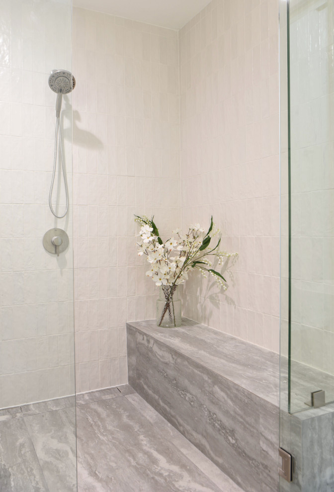 This is an example of a mid-sized modern wet room bathroom in Austin with flat-panel cabinets, medium wood cabinets, a freestanding tub, multi-coloured tile, porcelain tile, porcelain floors, an undermount sink, engineered quartz benchtops, grey floor, a hinged shower door, white benchtops, a shower seat, a double vanity and a floating vanity.