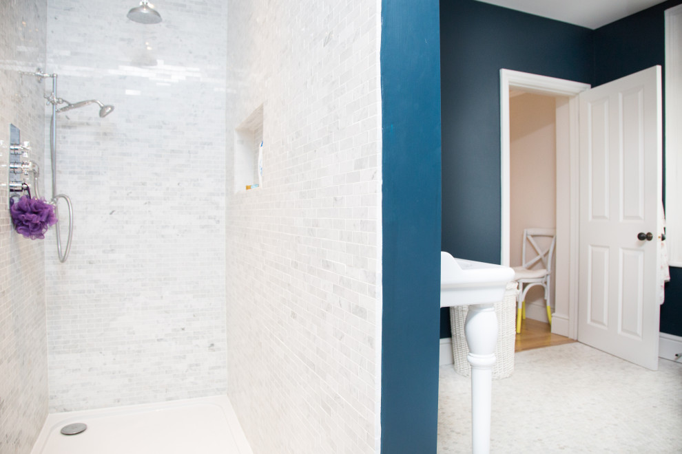 Design ideas for a small traditional kids bathroom in London with white cabinets, a claw-foot tub, an open shower, white tile, ceramic tile, blue walls, mosaic tile floors, a wall-mount sink, white floor and an open shower.