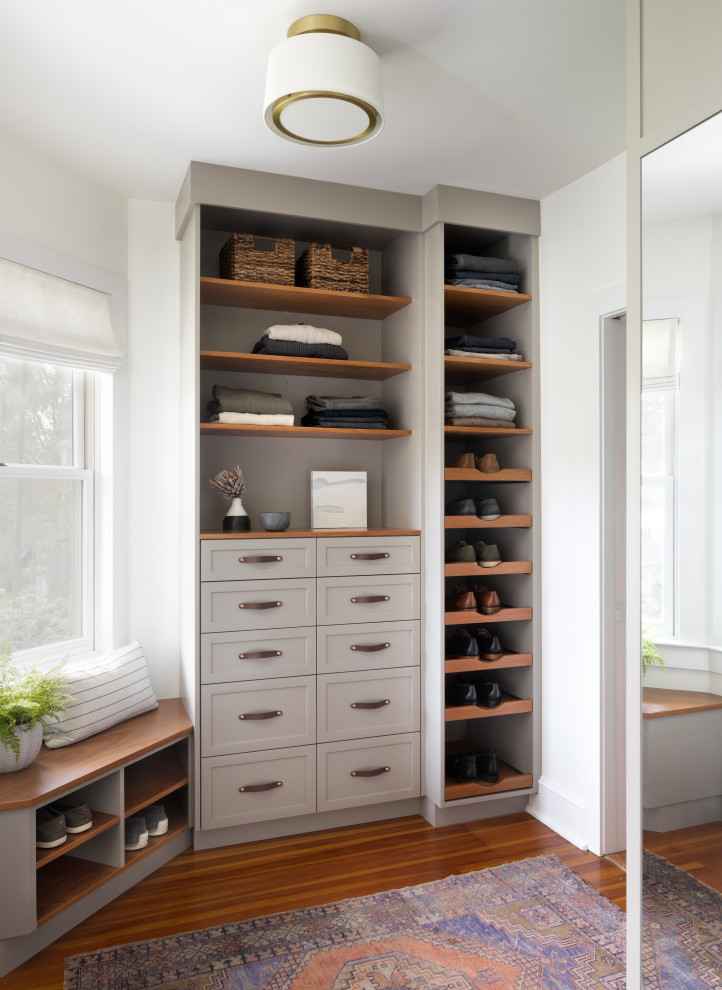 Transitional men's medium tone wood floor walk-in closet photo in Baltimore with gray cabinets