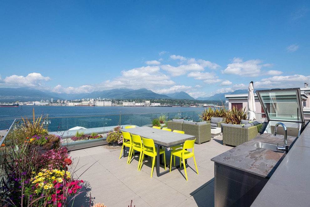 This is an example of a large contemporary rooftop and rooftop deck in Vancouver with no cover.