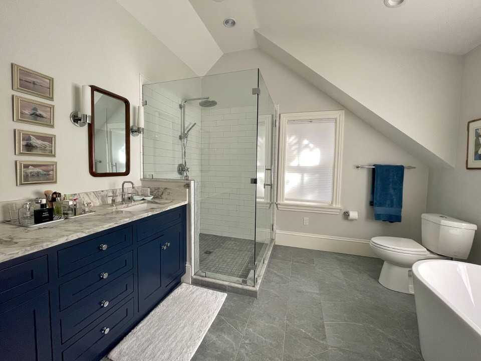 Bathroom - mid-sized scandinavian master white tile and subway tile porcelain tile, gray floor and double-sink bathroom idea in Providence with shaker cabinets, blue cabinets, a two-piece toilet, gray walls, an undermount sink, quartzite countertops, a hinged shower door, gray countertops and a built-in vanity