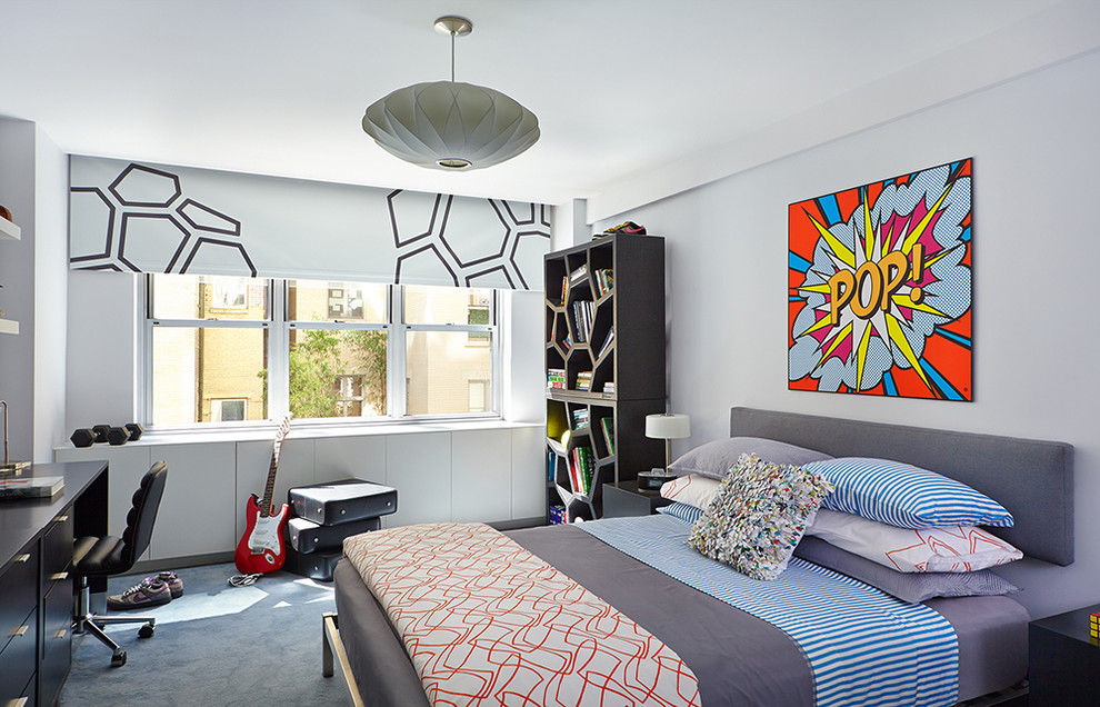 Photo of a mid-sized eclectic kids' room for boys in New York with blue walls, carpet and blue floor.