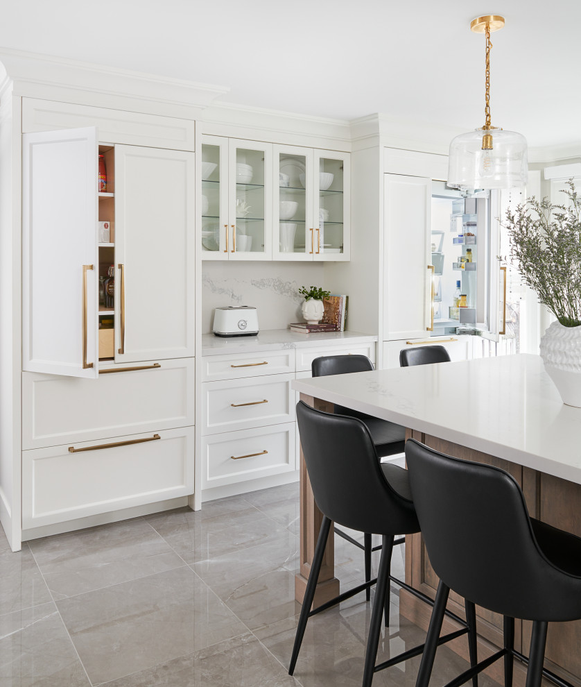 Inspiration for a mid-sized transitional u-shaped eat-in kitchen in Other with recessed-panel cabinets, white cabinets, quartz benchtops, white splashback, engineered quartz splashback, panelled appliances, with island and white benchtop.