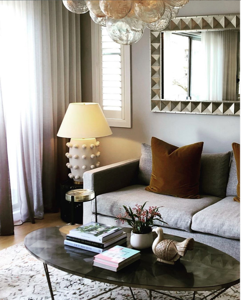 Inspiration for a large eclectic open concept living room in Melbourne with grey walls and medium hardwood floors.