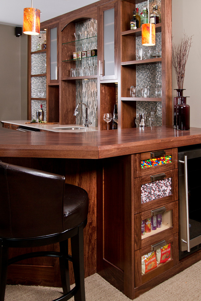 Design ideas for a transitional u-shaped seated home bar in Minneapolis with carpet, an undermount sink, shaker cabinets, dark wood cabinets, wood benchtops, multi-coloured splashback, mosaic tile splashback and brown benchtop.