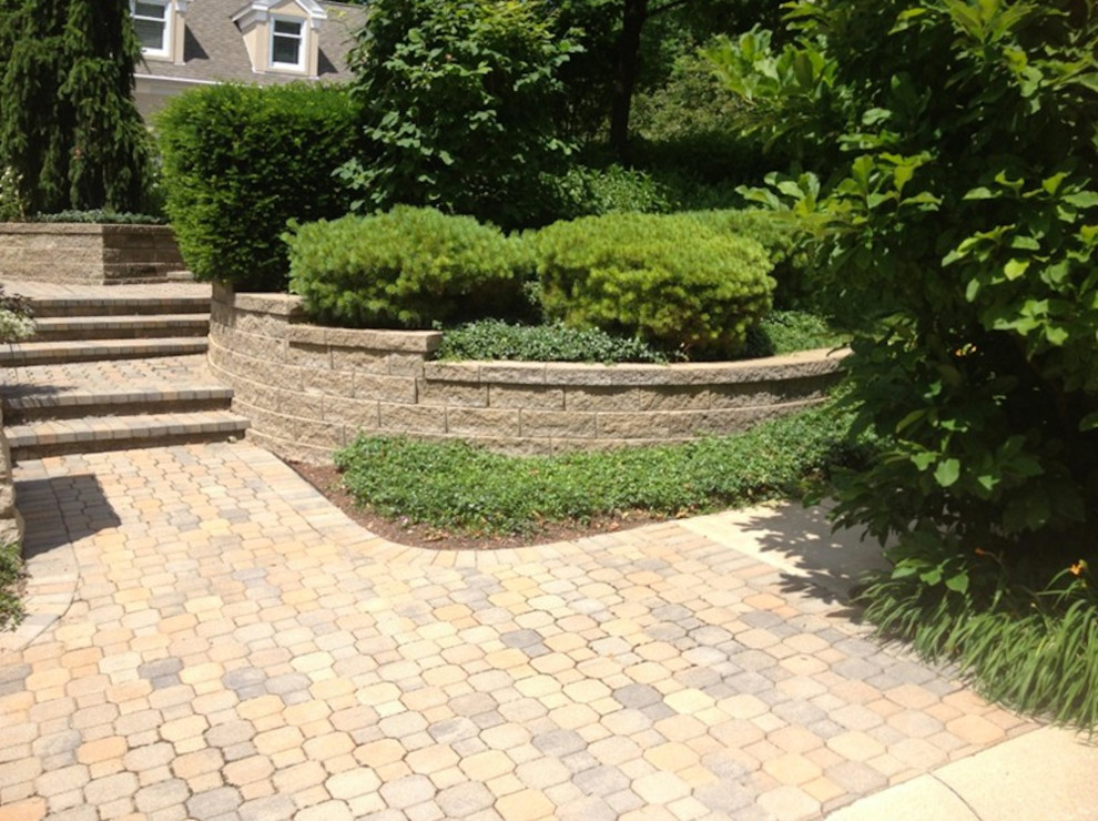 This is an example of a large shade side yard stone driveway.