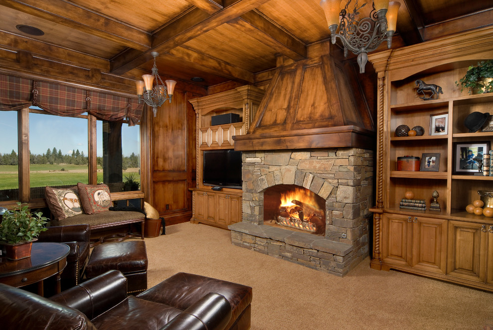 This is an example of a large traditional study room in Other with carpet, a standard fireplace and a stone fireplace surround.