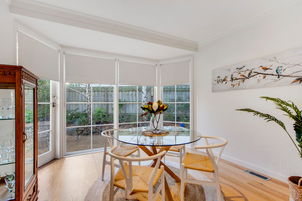 Photo of a beach style dining room in Melbourne.