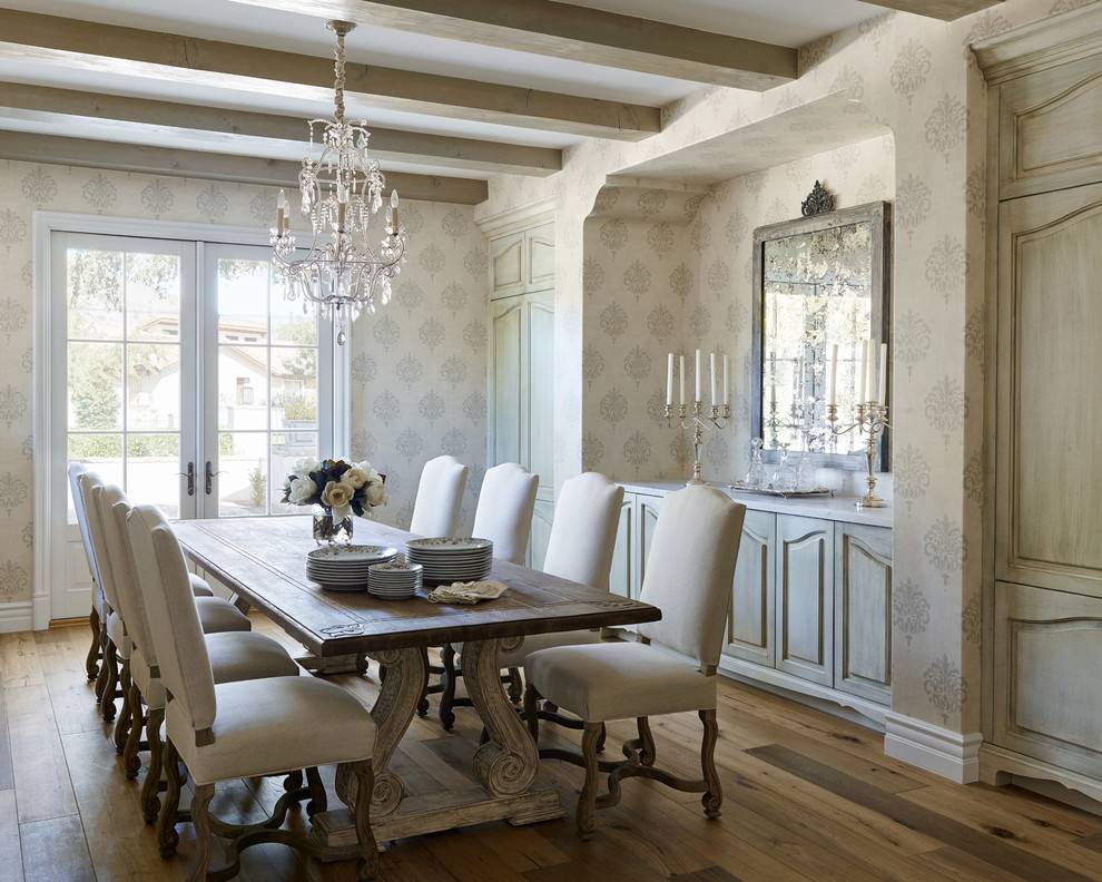Mediterranean dining room in Phoenix with multi-coloured walls and medium hardwood floors.