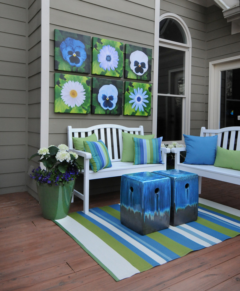 Example of a transitional shade home design design in Miami with decking