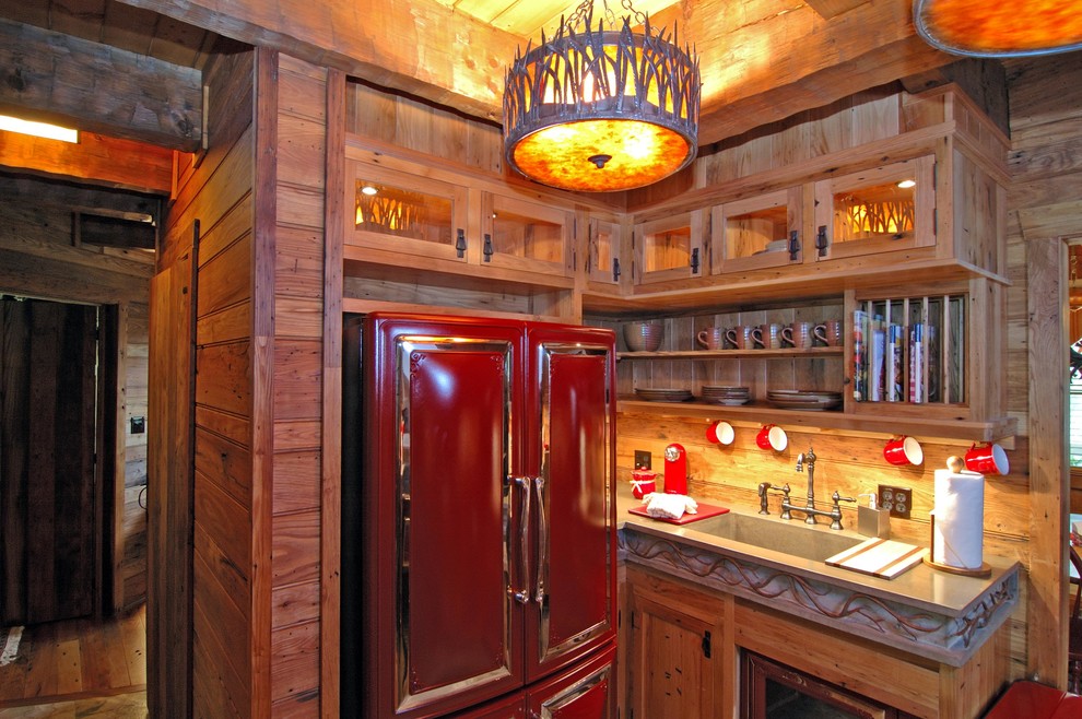 This is an example of a country kitchen in Other with coloured appliances.