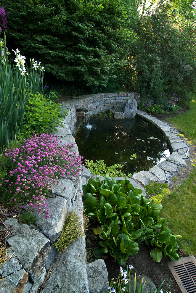 Traditional garden in Seattle with a water feature.