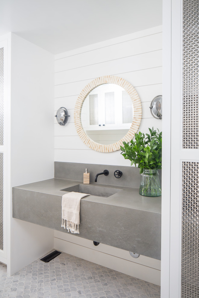 Photo of a mid-sized beach style 3/4 bathroom in Orange County with grey cabinets, grey benchtops, white walls, mosaic tile floors, an integrated sink and grey floor.