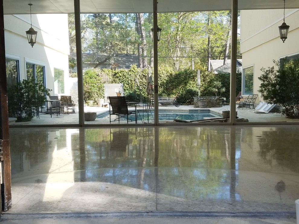 Photo of a midcentury entryway in Houston with terrazzo floors and multi-coloured floor.