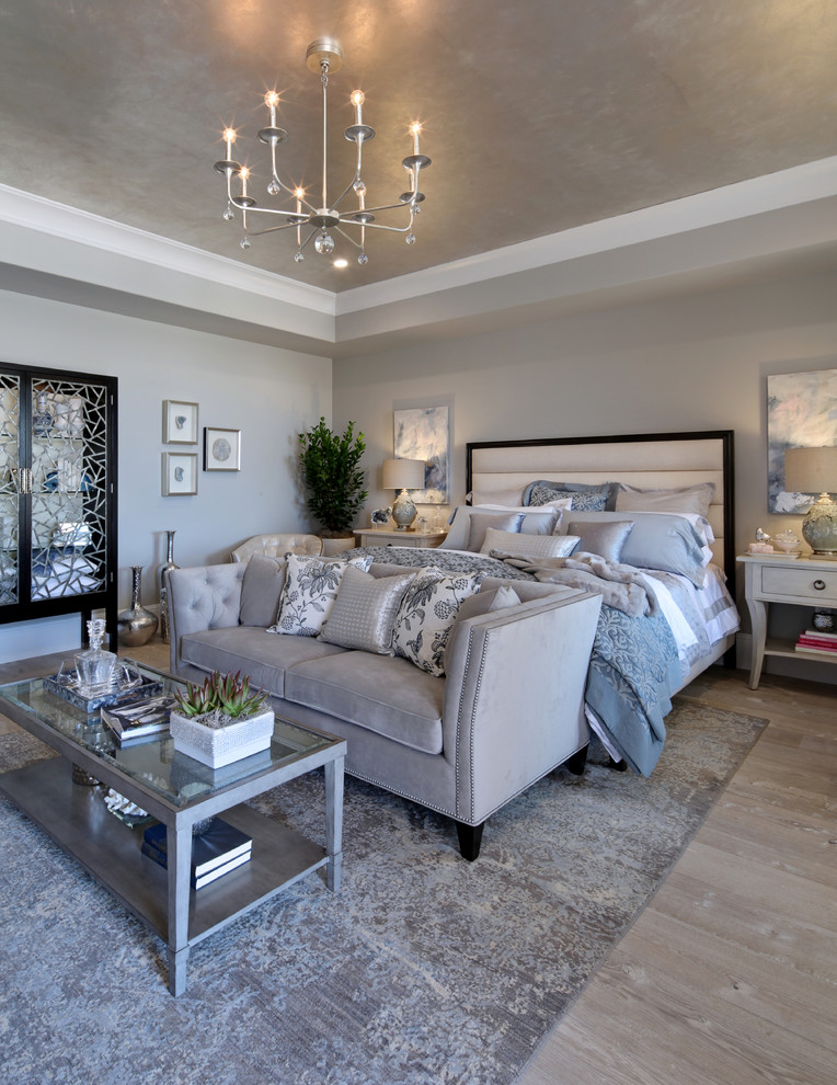 Inspiration for a large transitional master bedroom in Orange County with grey walls, light hardwood floors, no fireplace and grey floor.