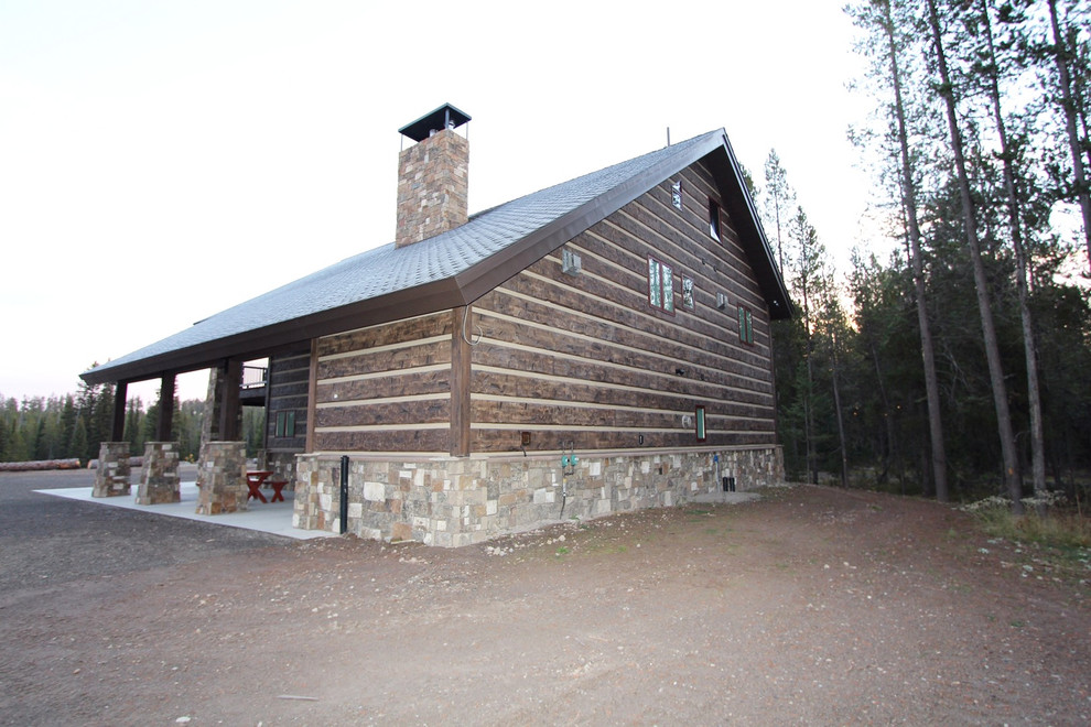 Inspiration for a rustic two-story concrete brown home design remodel