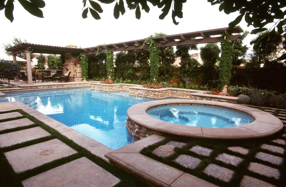Design ideas for a large mediterranean backyard rectangular lap pool in Los Angeles with a hot tub.