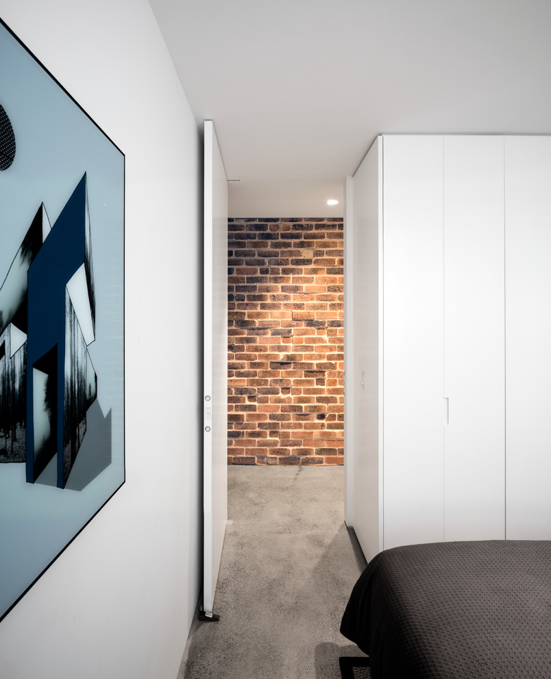 Photo of a midcentury bedroom in Sydney.