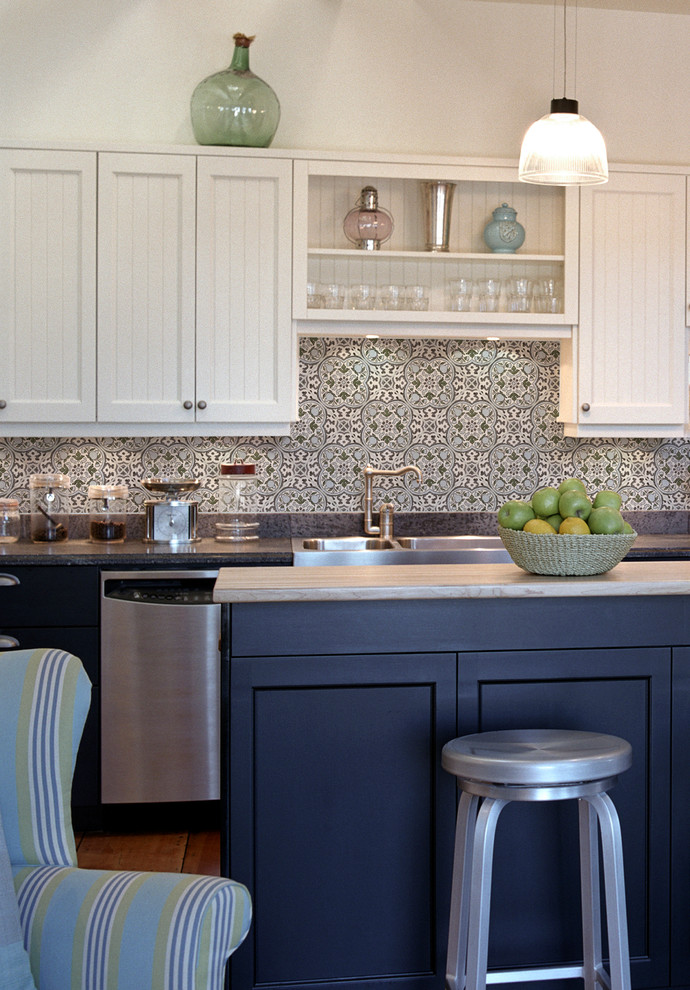 Photo of a transitional kitchen in San Diego with stone tile splashback.