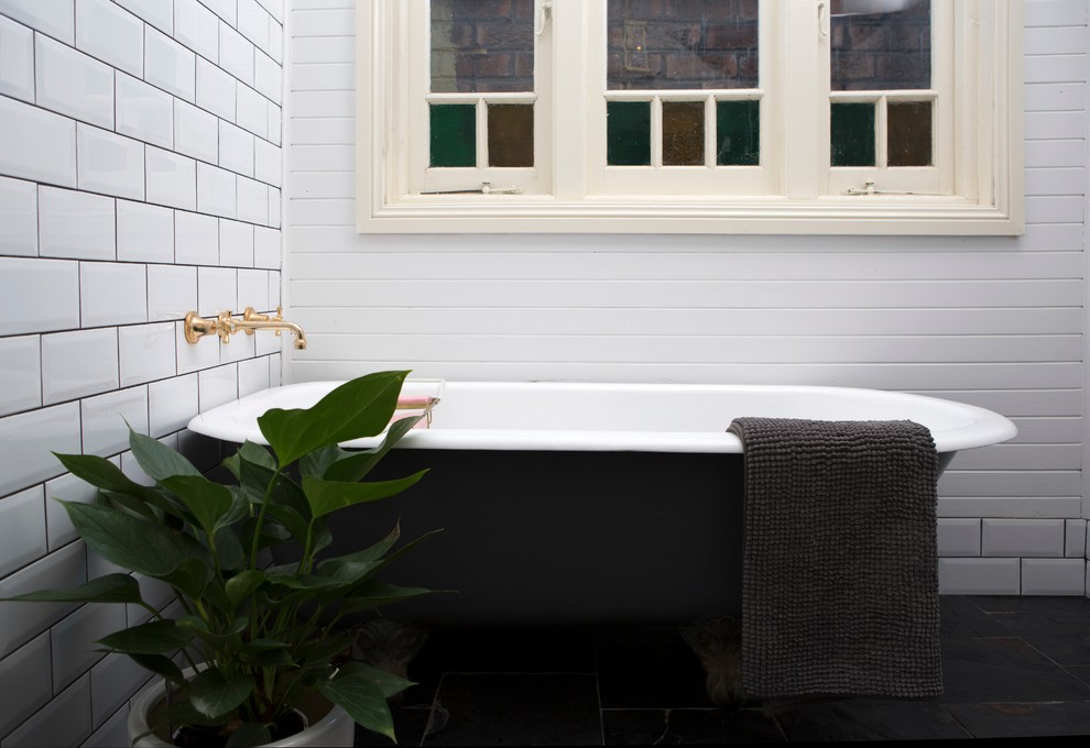 Design ideas for a traditional bathroom in Wollongong with a claw-foot tub, white tile, subway tile, white walls and ceramic floors.