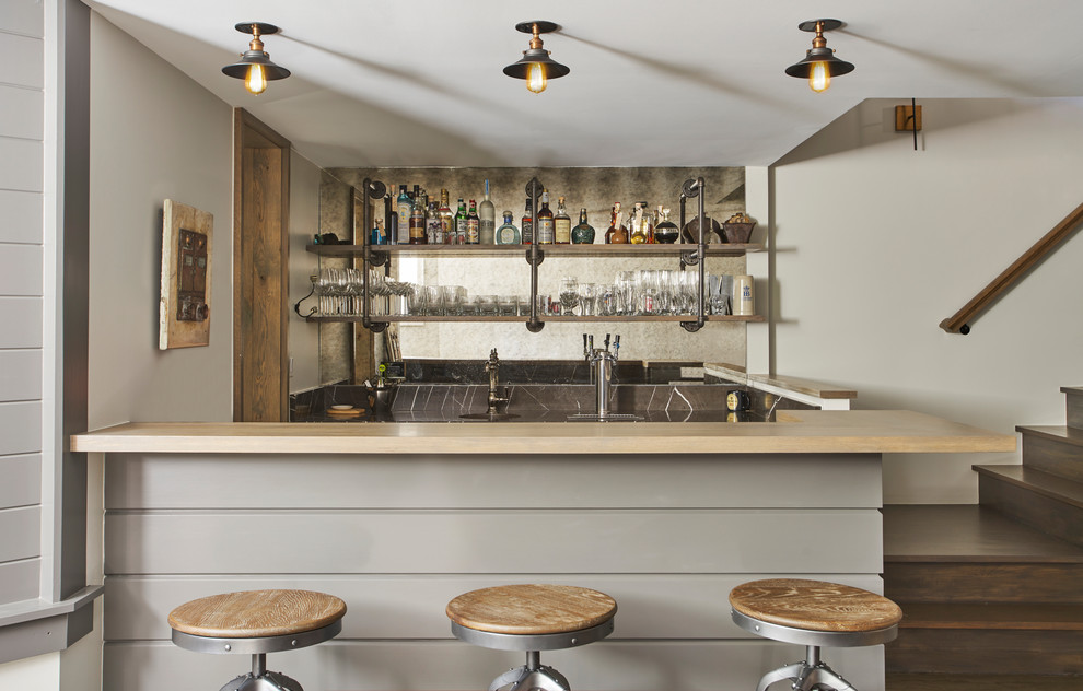 Inspiration for a mid-sized contemporary seated home bar in Chicago with wood benchtops, mirror splashback, open cabinets, light wood cabinets, multi-coloured splashback, medium hardwood floors, brown floor and beige benchtop.