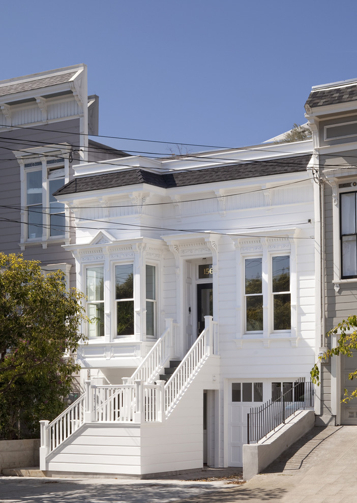 Inspiration for a small traditional two-storey white exterior in San Francisco with wood siding.