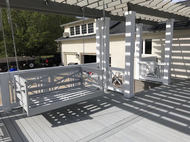 Large traditional backyard deck in Nashville with a pergola.