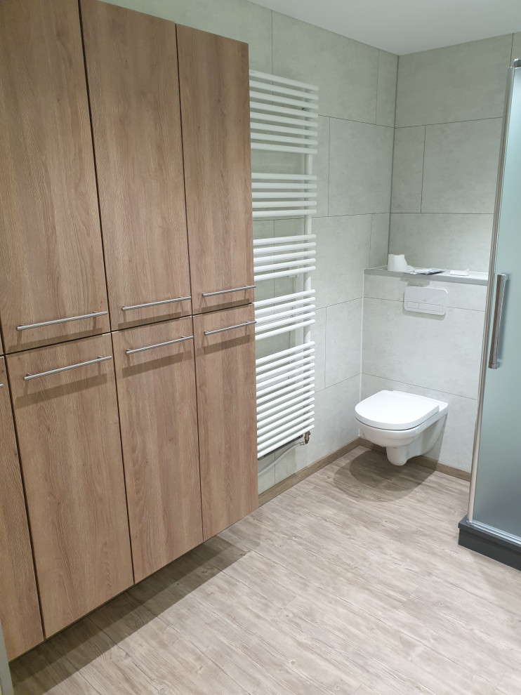 Contemporary master bathroom in Lille with brown cabinets, a double shower, a wall-mount toilet, ceramic tile, grey walls, linoleum floors, a console sink, beige floor, a hinged shower door and white benchtops.
