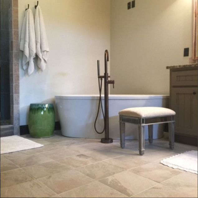 Inspiration for a mid-sized transitional master ceramic tile and beige floor freestanding bathtub remodel with beaded inset cabinets, gray cabinets, a one-piece toilet, beige walls, an undermount sink and granite countertops