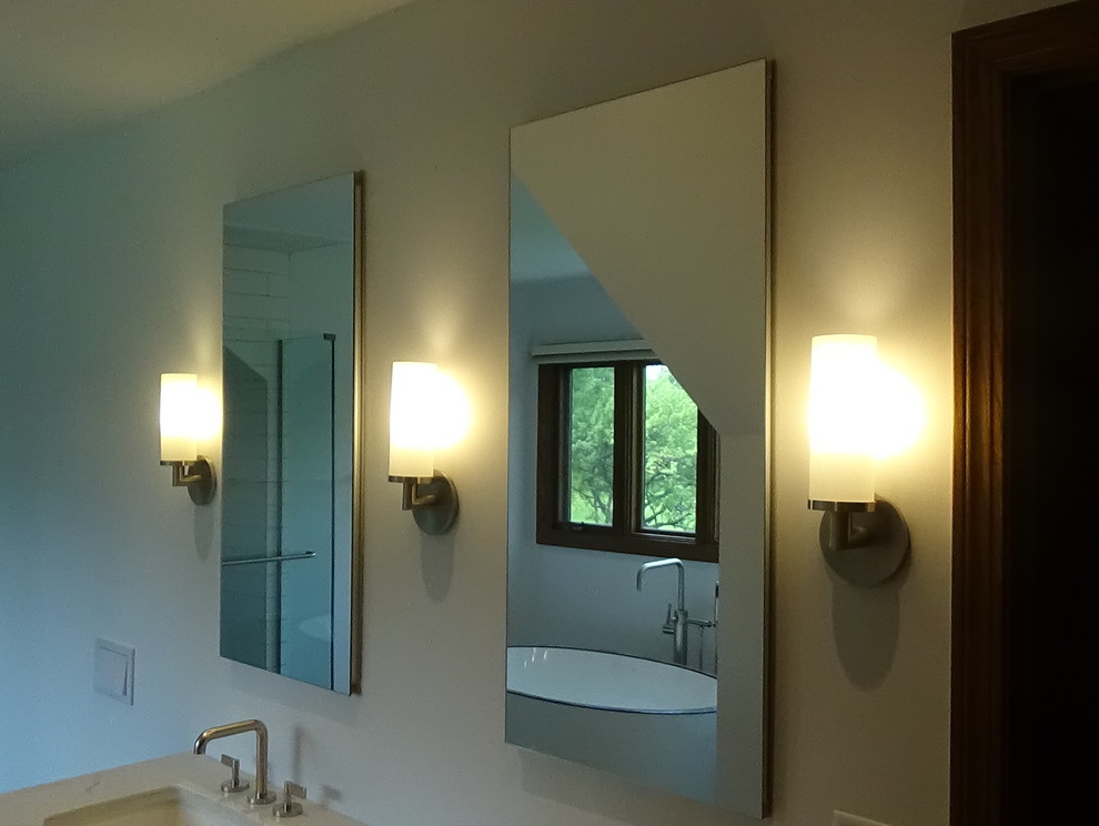 Mid-sized transitional master white tile and ceramic tile porcelain tile and beige floor freestanding bathtub photo in Chicago with recessed-panel cabinets, medium tone wood cabinets, a wall-mount toilet, white walls, an undermount sink, quartz countertops, a hinged shower door and white countertops