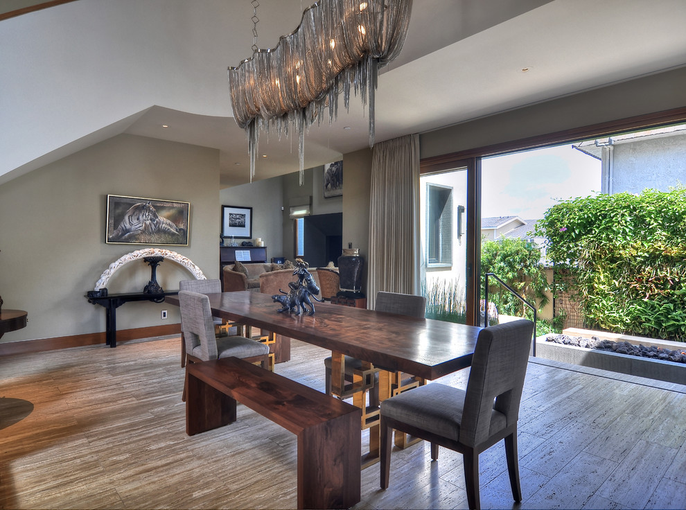 This is an example of a contemporary dining room in Orange County with grey walls.
