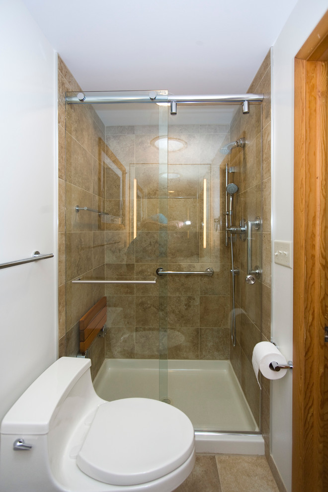 Small contemporary master bathroom in Philadelphia with flat-panel cabinets, medium wood cabinets, an alcove shower, a one-piece toilet, beige tile, porcelain tile, white walls, porcelain floors, an integrated sink and solid surface benchtops.