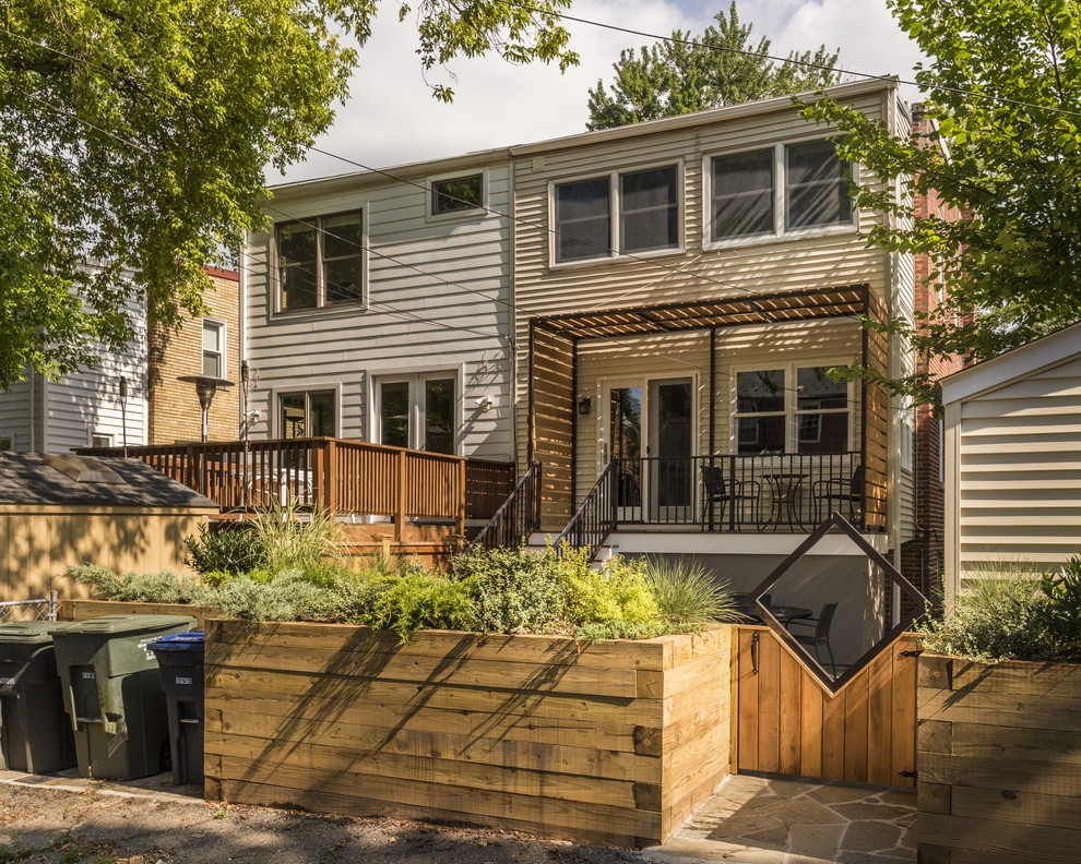 Small transitional backyard deck photo in DC Metro with a pergola