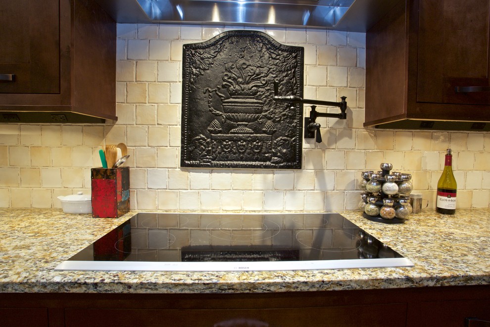 Inspiration for a large transitional l-shaped medium tone wood floor open concept kitchen remodel with a farmhouse sink, shaker cabinets, medium tone wood cabinets, marble countertops, beige backsplash, stone tile backsplash, colored appliances and an island