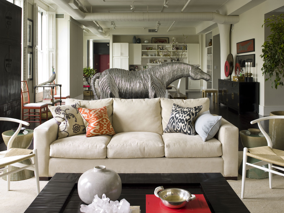 Photo of an eclectic open concept living room in New York with white walls.