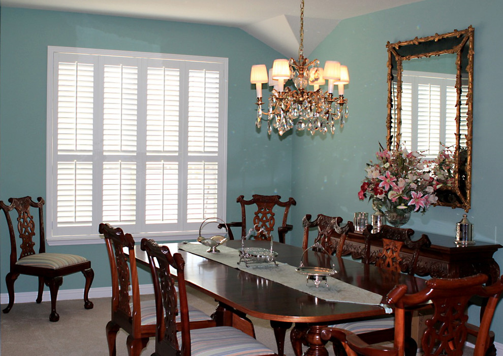 This is an example of a mid-sized traditional separate dining room in Austin with blue walls, carpet, no fireplace and beige floor.