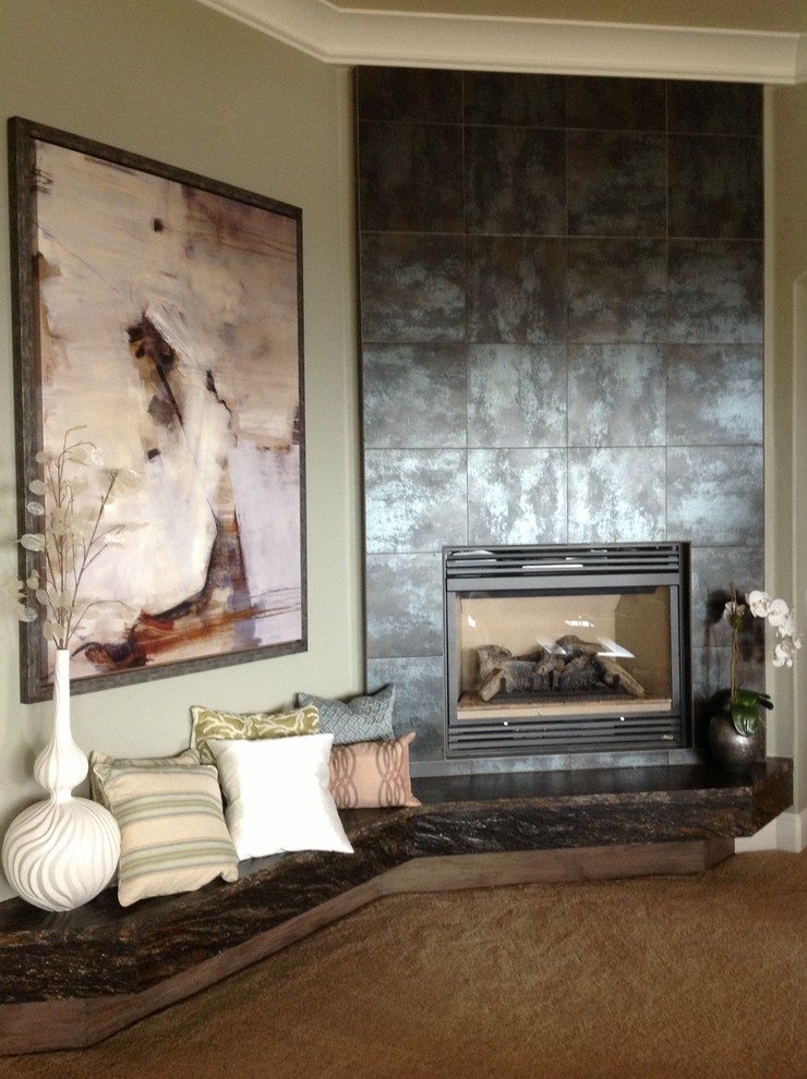 Photo of a transitional enclosed family room in Sacramento with beige walls, carpet, a standard fireplace, a metal fireplace surround and no tv.