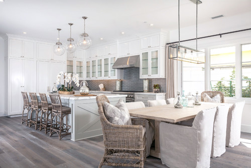Spacious open-concept kitchen with white cabinets, gray flooring, and soft neutral finishes reflecting popular IKEA kitchen cabinet colors Canada 2026.
