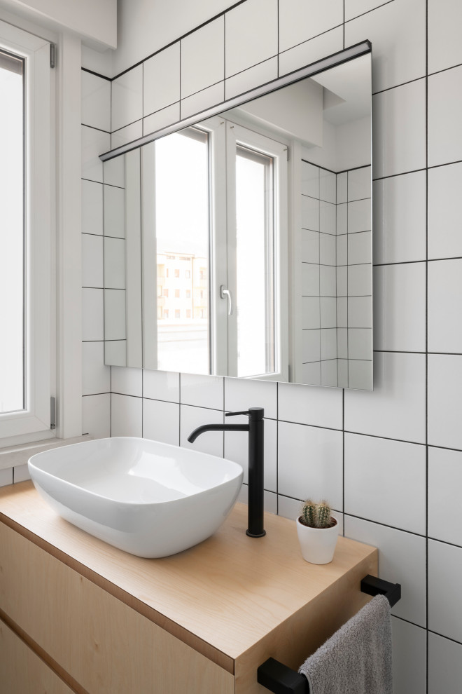 Design ideas for a small contemporary cloakroom in Venice with flat-panel cabinets, white tiles, terracotta tiles, concrete flooring, wooden worktops, grey floors, beige worktops and a floating vanity unit.
