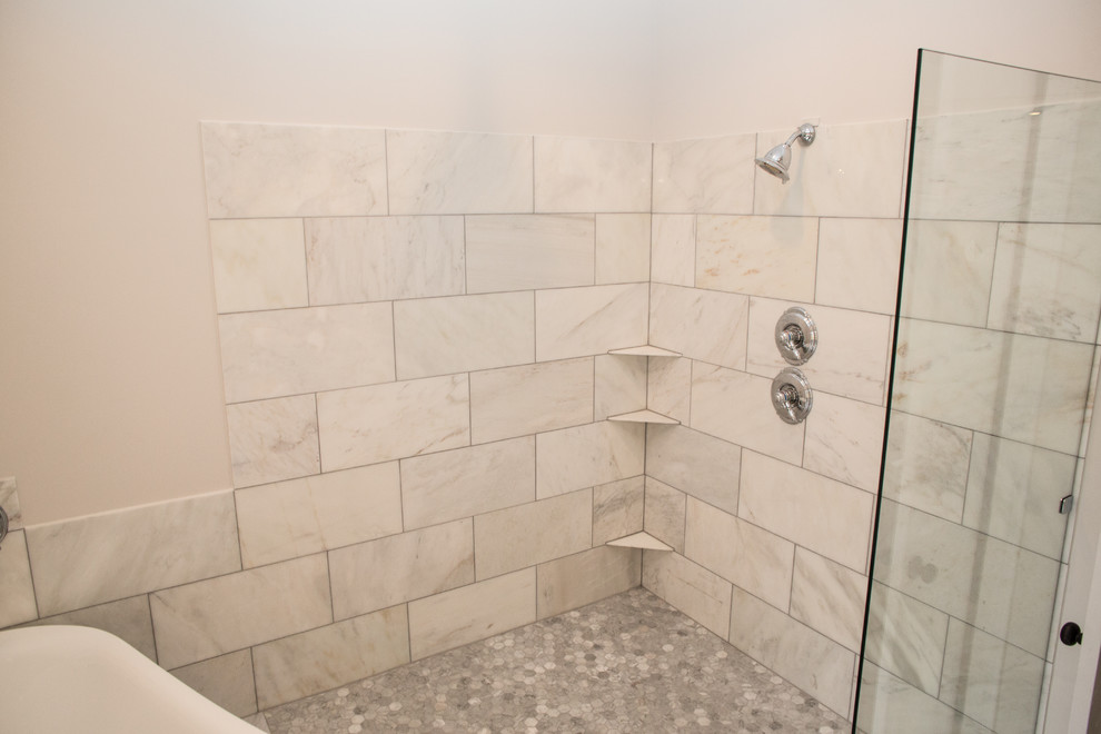 This is an example of a large traditional master bathroom in Other with shaker cabinets, white cabinets, marble benchtops, gray tile, a freestanding tub, an open shower, an undermount sink, grey walls and marble floors.