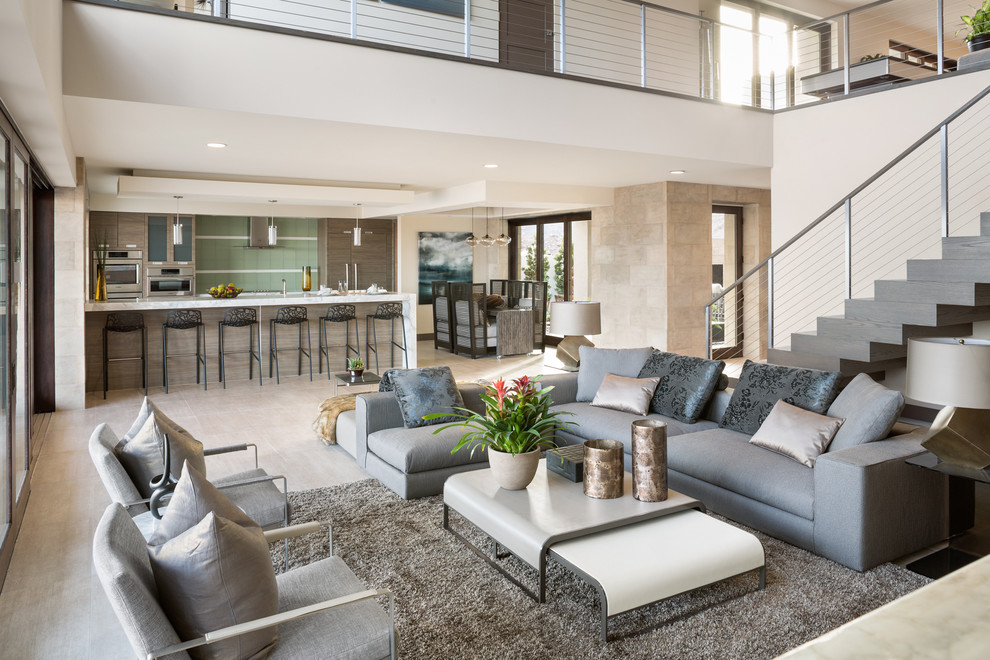 This is an example of an expansive contemporary open concept living room in Las Vegas with a home bar, brown walls, dark hardwood floors and brown floor.